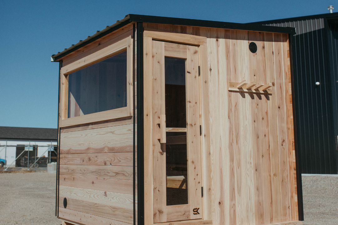The Summit outdoor sauna with pitched steel roof and natural cedar walls