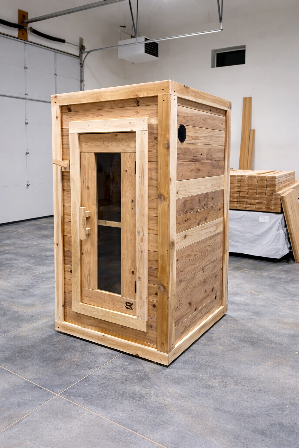 Sweat Box interior detail showing cedar bench and heater placement